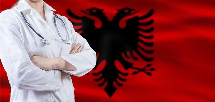 Framed Print : Doctor with crossed arms on Albania flag Framed Print : Doctor with crossed arms on Albania flag