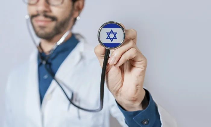Framed Print : Doctor holding stethoscope with Israel flag Framed Print : Doctor holding stethoscope with Israel flag