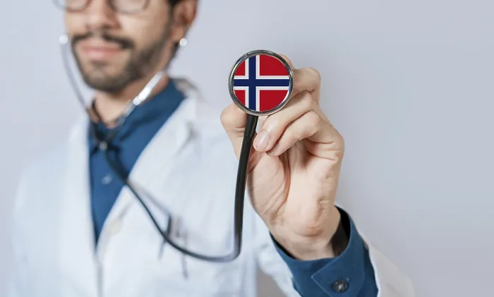 Framed Print : Doctor holding stethoscope with Norway flag