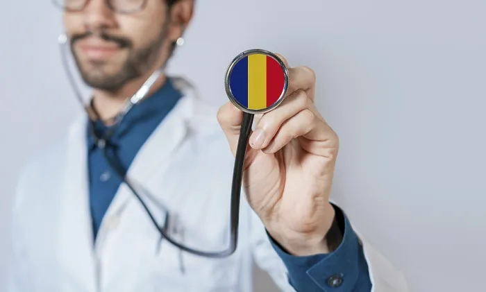 Framed Print : Doctor holding stethoscope with Romania flag Framed Print : Doctor holding stethoscope with Romania flag