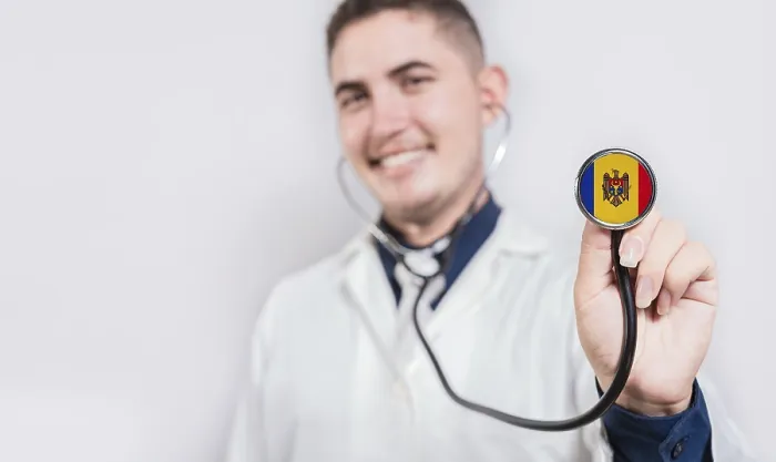 Framed Print : Doctor showing stethoscope with Moldova flag