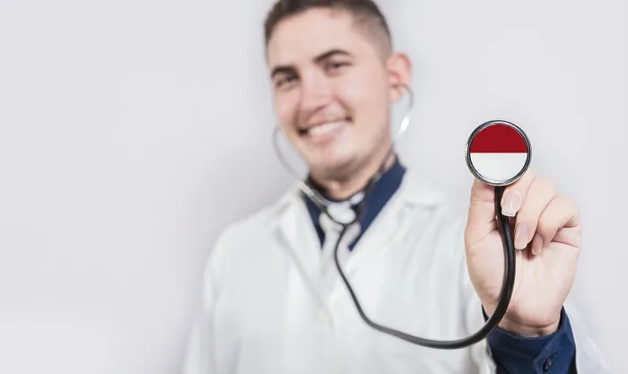 Framed Print : Doctor showing stethoscope with Monaco flag