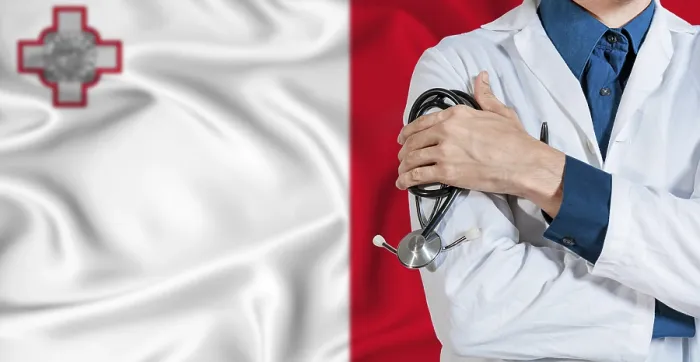 Framed Print : Doctor with stethoscope on Malta flag