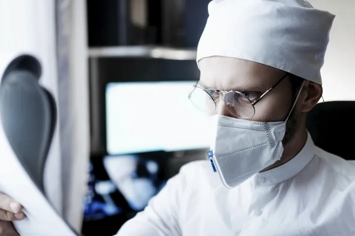 Framed Print : Doctor wearing protective gear