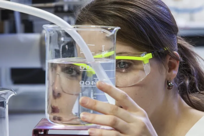 Framed Print : Doctoral student during her research work on a film drawing bench at the Institute for Pharmaceutical Technology