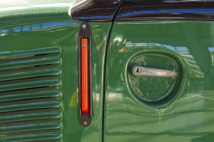 Framed Print : Detail of a door handles and lock on an nostalgic green car in old mechanic