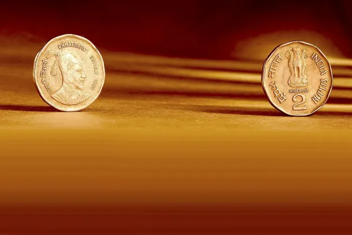 Framed Print : Double pair Indian currency two rupees coin front side and backside manner embossed Chhatrapati Shivaji 1999 on orange background