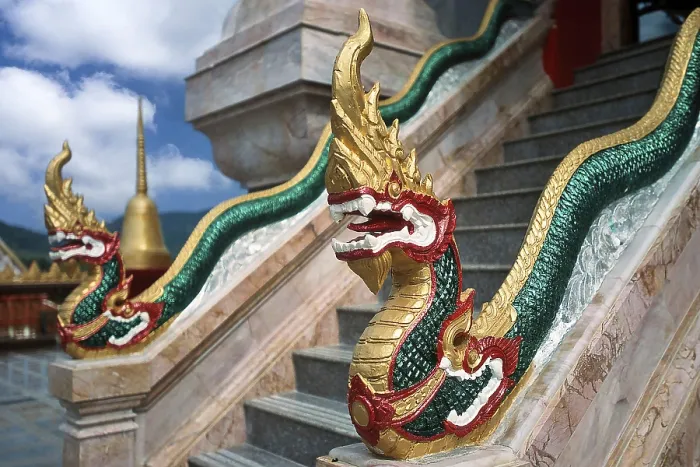 Framed Print : Dragon on staircase of tower with top of Chedi highest building in temple complex buddhist monastery Wat Chalong Wat