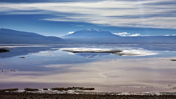 Framed Print : Dramatic cloud formations over a reflecting lake and distant mountain ranges