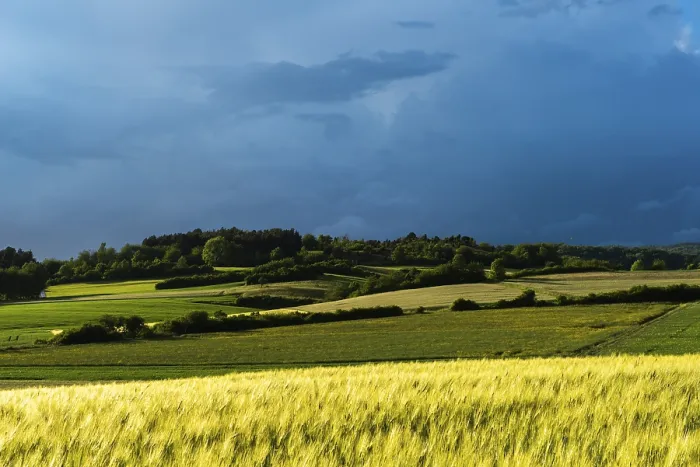 Framed Print : Dramatic cloudy sky with approaching storm and last rays of sunshine