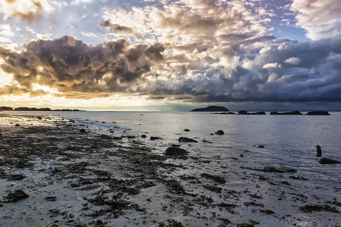 Framed Print : Dramatic cloudy sky over coastline