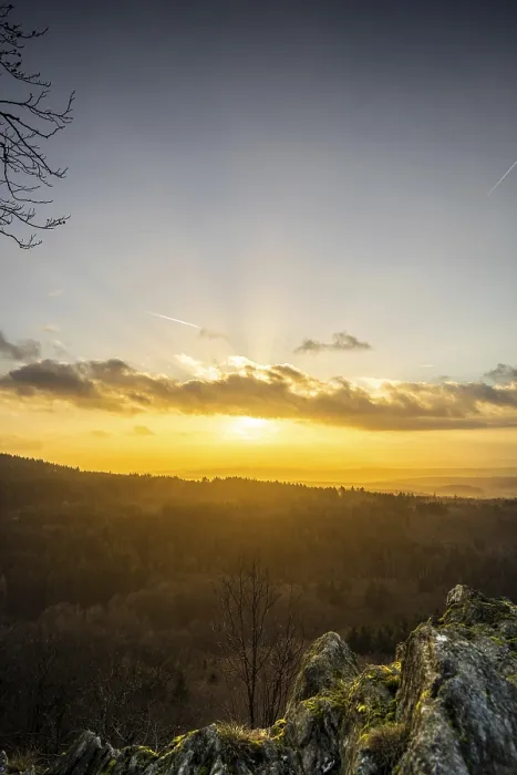Framed Print : A Dramatic Sunset in the Evening with Clouds over a Valley in the Forest