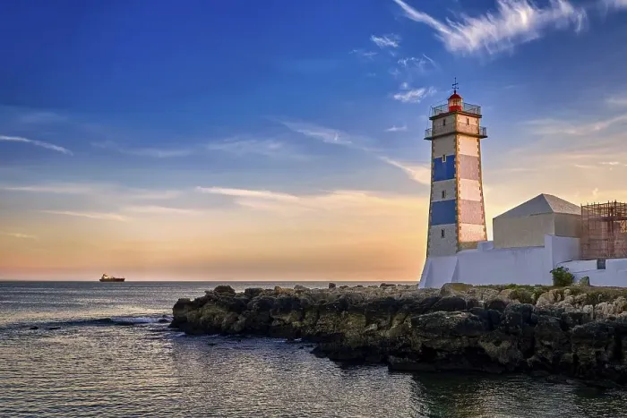 Framed Print : Dramatic sunset on sea shore and Santa Marta lighthouse in Cascais Framed Print : Dramatic sunset on sea shore and Santa Marta lighthouse in Cascais