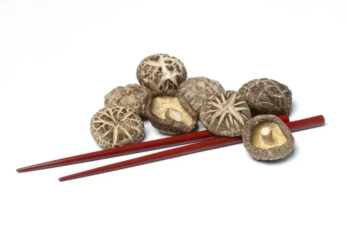 Framed Print : Dried shiitake mushrooms and chopsticks