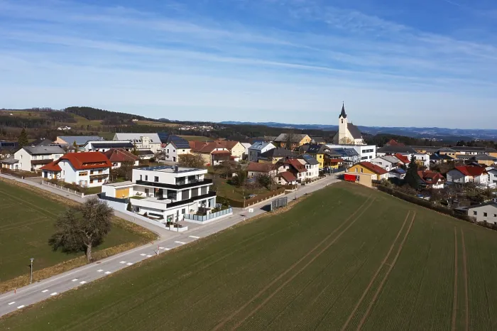 Framed Print : Drone image, view of village with parish church