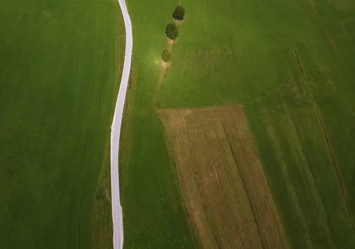 Framed Print : Drone shot, agricultural landscape with country road from above