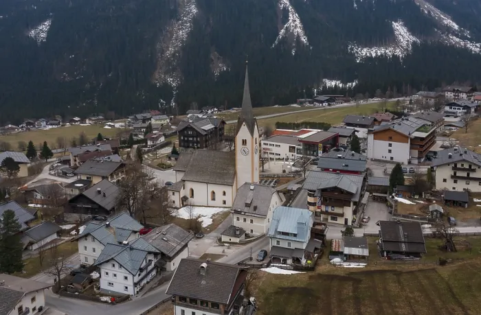Framed Print : Drone shot, view of village with parish church Framed Print : Drone shot, view of village with parish church