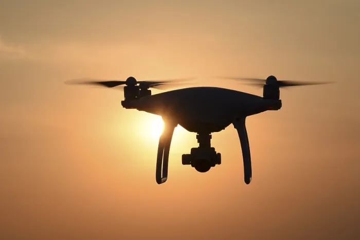 Framed Print : Drone silhouette against the background of the sunset