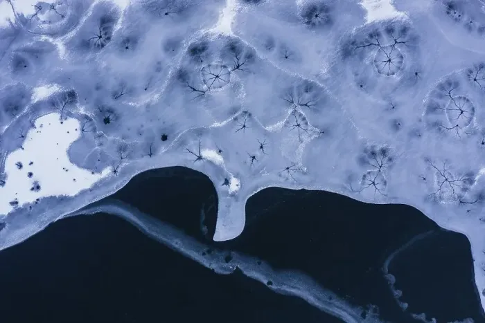 Framed Print : Drone view. Abstract forms created on surface of freezing lake Framed Print : Drone view. Abstract forms created on surface of freezing lake