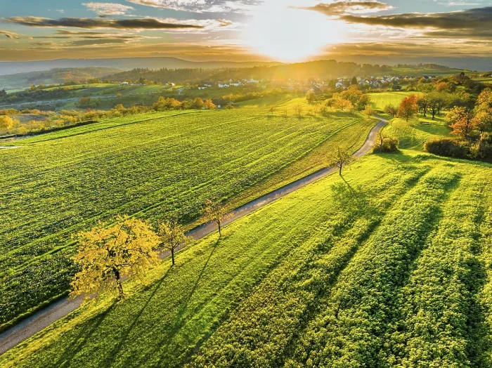 Framed Print : Drone view of sundown over forest and rural landscape in autumn Framed Print : Drone view of sundown over forest and rural landscape in autumn