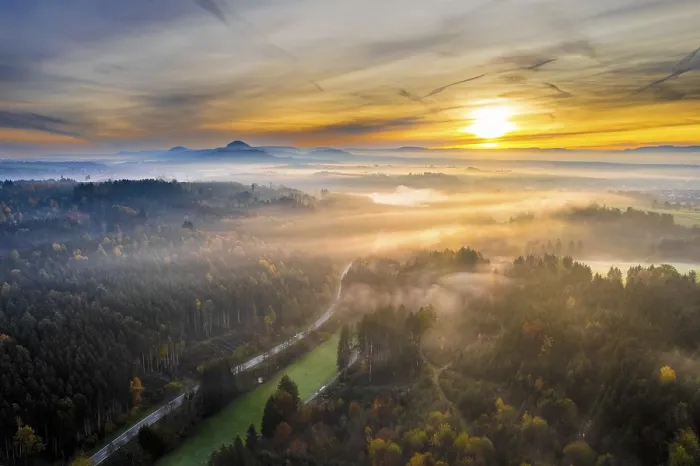 Framed Print : Drone view of sunrise over forest and rural landscape in autumn