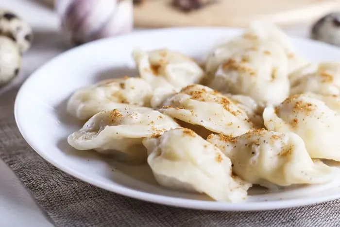 Framed Print : Dumplings on a white plate, selective focus