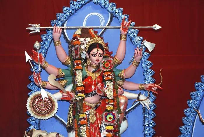 Framed Print : Durga clay model holding weapons and god shiva in background on Durga puja Framed Print : Durga clay model holding weapons and god shiva in background on Durga puja