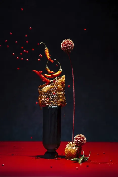 Framed Print : Dynamic display with chilies peppers and honeycomb on a black background Framed Print : Dynamic display with chilies peppers and honeycomb on a black background