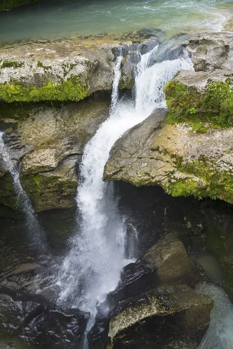 Framed Print : Dynamic waterfall flowing through a rocky gorge