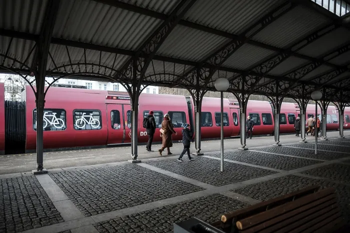 Framed Print : Dyrehaven Train station platform with passengers boarding a red train Framed Print : Dyrehaven Train station platform with passengers boarding a red train