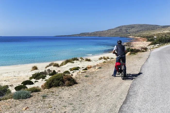 Framed Print : E-bike cycle tour, Bestager enjoys view of turquoise blue water and dream beach