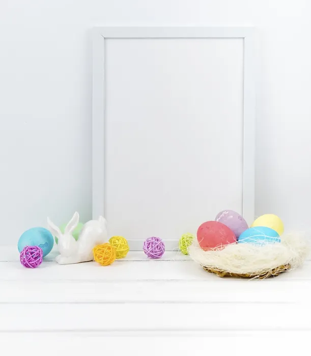 Framed Print : Easter eggs nest with blank frame table