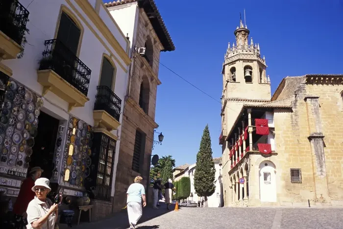 Framed Print : Elderly British tour group exploring the historic old town by the cathedral in Ronda, Andalusia, Spain, Europe