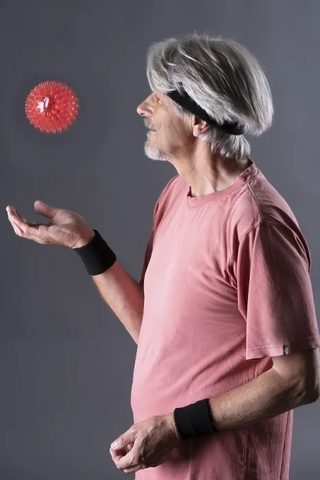 Framed Print : Elderly man with fitness outfit trains with fitness ball Framed Print : Elderly man with fitness outfit trains with fitness ball