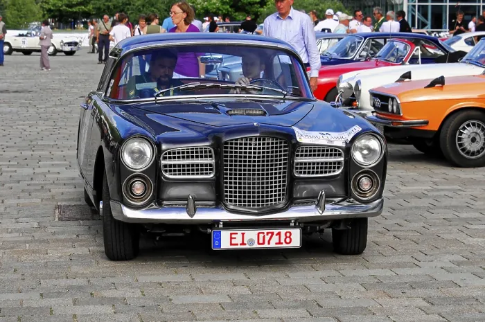 Framed Print : Elegant black coupe at a classic car show surrounded by other classic vehicles Framed Print : Elegant black coupe at a classic car show surrounded by other classic vehicles