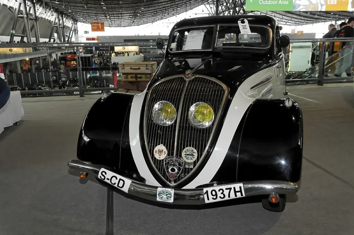 Framed Print : An elegant black vintage car from 1937 with chrome details and yellow headlights