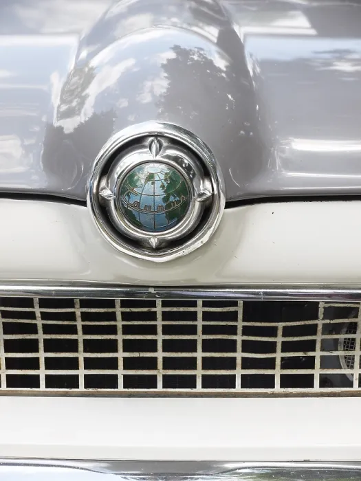 Framed Print : Emblem of a Ford Taunus classic car with a globe
