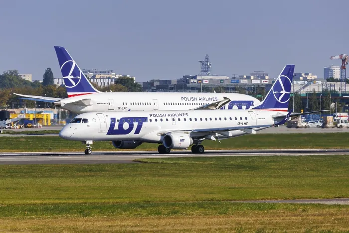 Framed Print : An Embraer 190 aircraft of LOT Polish Airlines with the registration number SP-LME at the airport in Warsaw