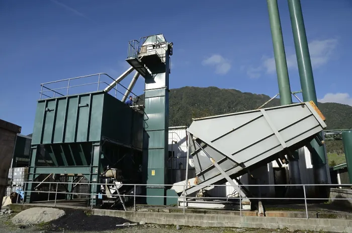 Framed Print : An engineer feeds coal into the hopper that fuels a boiler for a rendering plant Framed Print : An engineer feeds coal into the hopper that fuels a boiler for a rendering plant