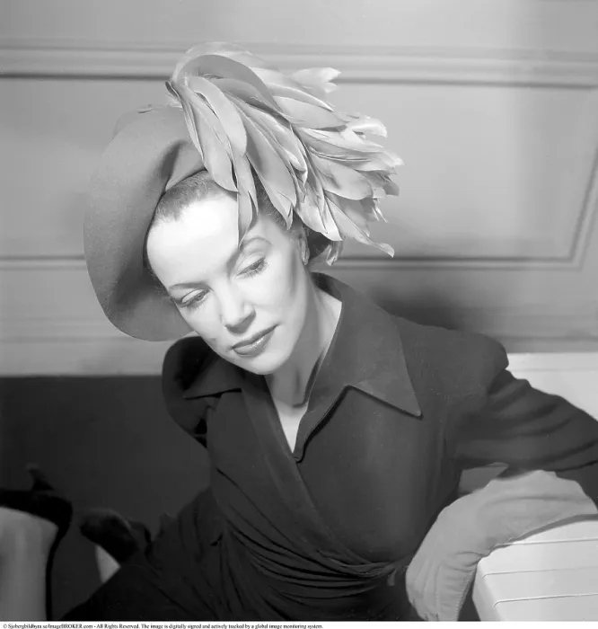 Framed Print : England 1945. A fashionable young woman wearing a creative hat and decoration Framed Print : England 1945. A fashionable young woman wearing a creative hat and decoration