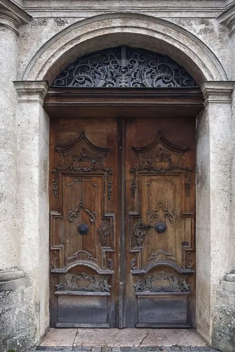 Framed Print : Entrance door of the former monastery church of St