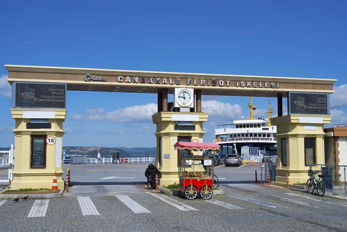 Framed Print : The entrance to the ferry terminal with clock and a kiosk in sunny weather