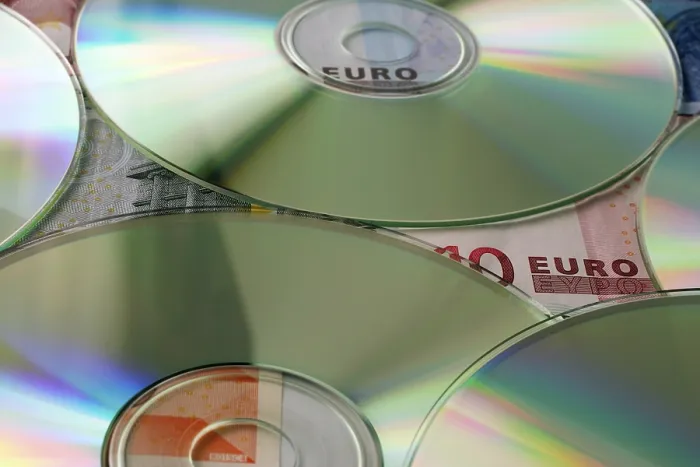 Framed Print : Euro-bills and CD-Rs Framed Print : Euro-bills and CD-Rs