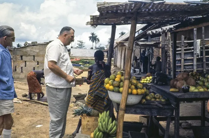 Framed Print : European emigrant buying fruit at a street market, Sierra Leone, West Africa 1963 1964, Africa