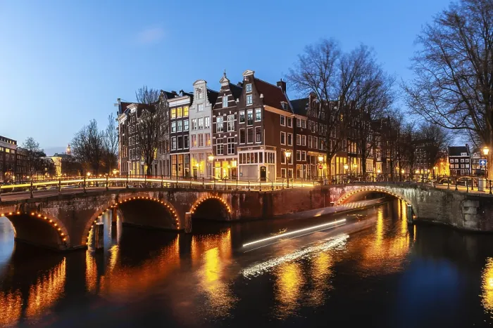 Framed Print : Evening mood, light tracks, boat cruises through canal with bridge Framed Print : Evening mood, light tracks, boat cruises through canal with bridge