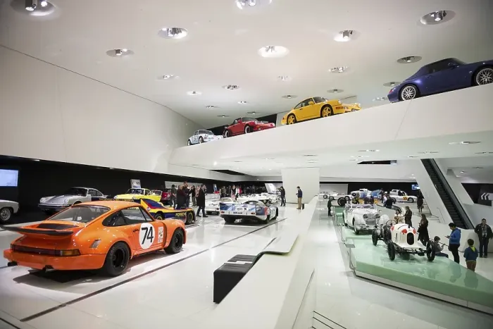 Framed Print : Exhibition room with various Porsche cars