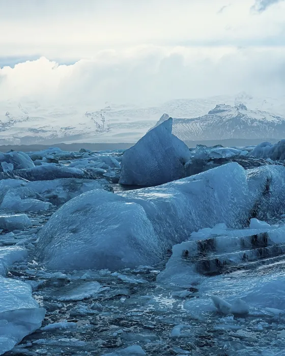 Framed Print : Expansive view of blue glaciers scattered across a wide icy landscape