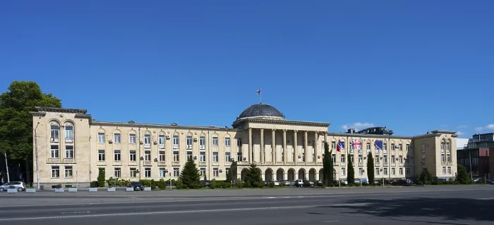 Framed Print : Extensive classical building in panoramic view under bright blue sky