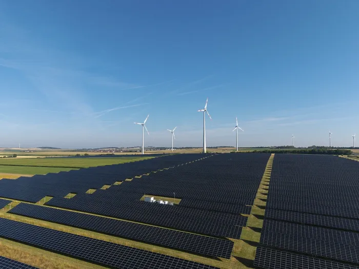 Framed Print : Extensive solar panels with wind turbines in sunny surroundings