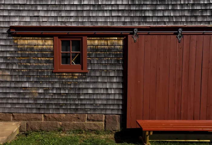 Framed Print : The exterior of an old barn and door